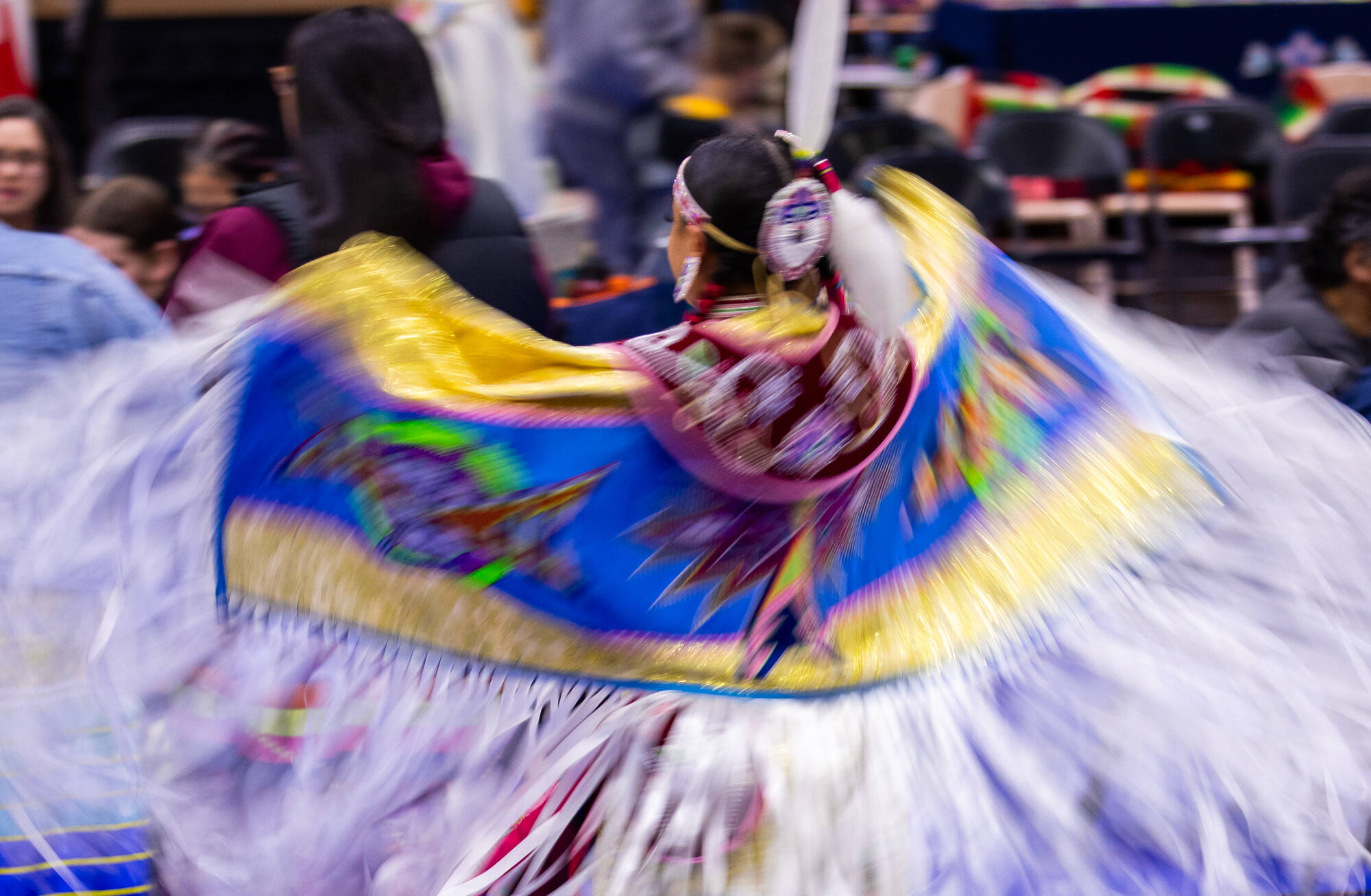 Jasmine Hosier dances during the annual Walks of Life Powwow at Grand Valley State University on April 12